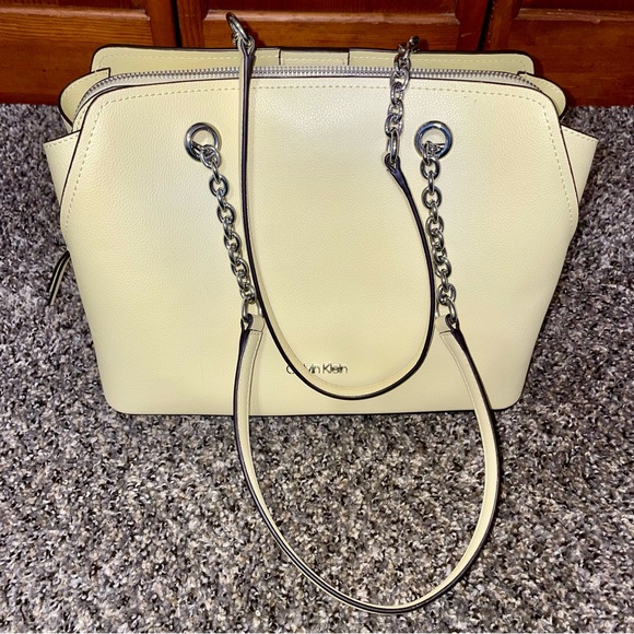 Calvin Klein Handbags - Calvin Klein Pale Yellow Pebble Leather Shoulder Bag